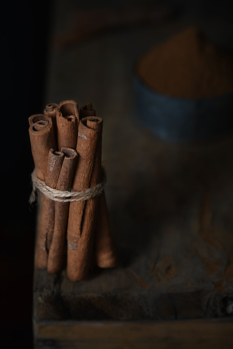 a bunch of cinnamon sticks tied to a piece of wood